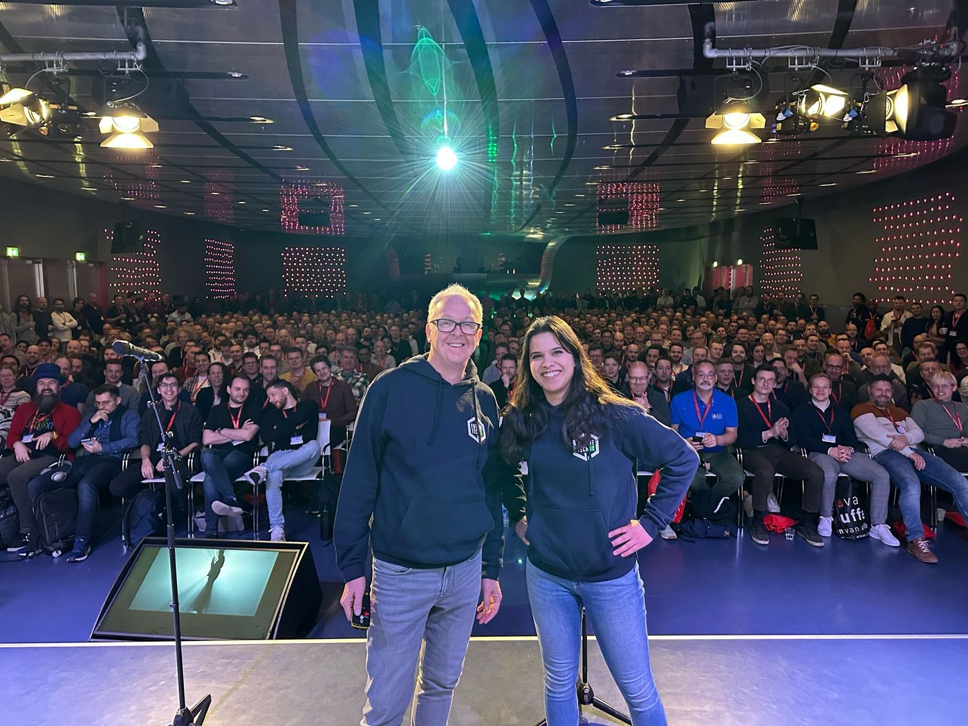 Anjuli and Dennis on stage after their performance